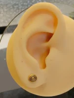 Gold Sun Pattern Stud Earrings – Unisex Circular Geometric Design - Image 5